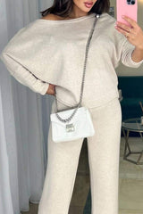 Damski komplet z asymetrycznym topem i spodniami casualowymi