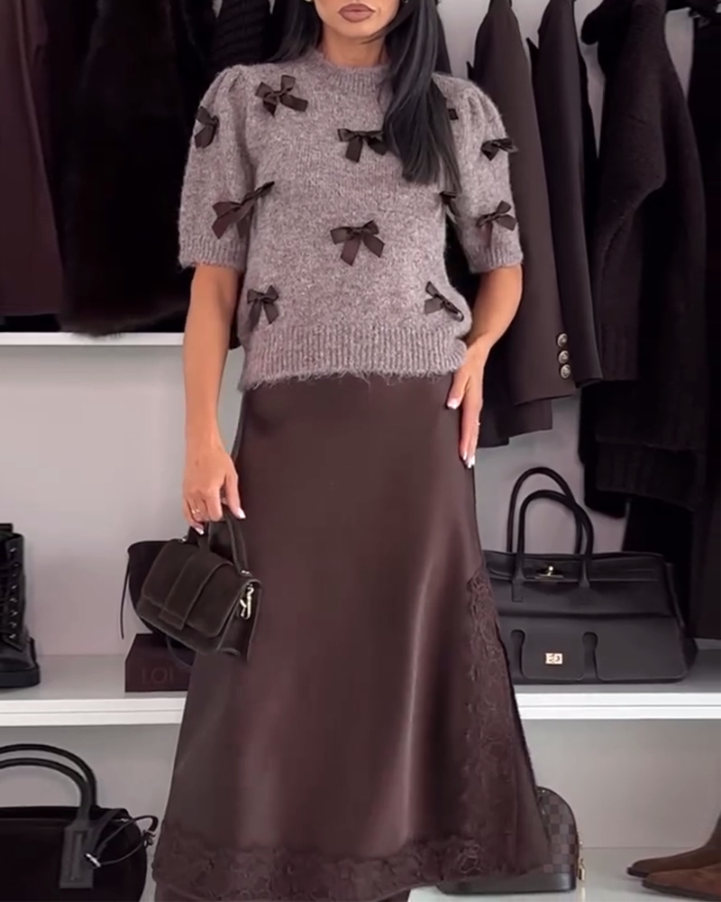 Damski sweter z okrągłym dekoltem i ozdobną kokardką