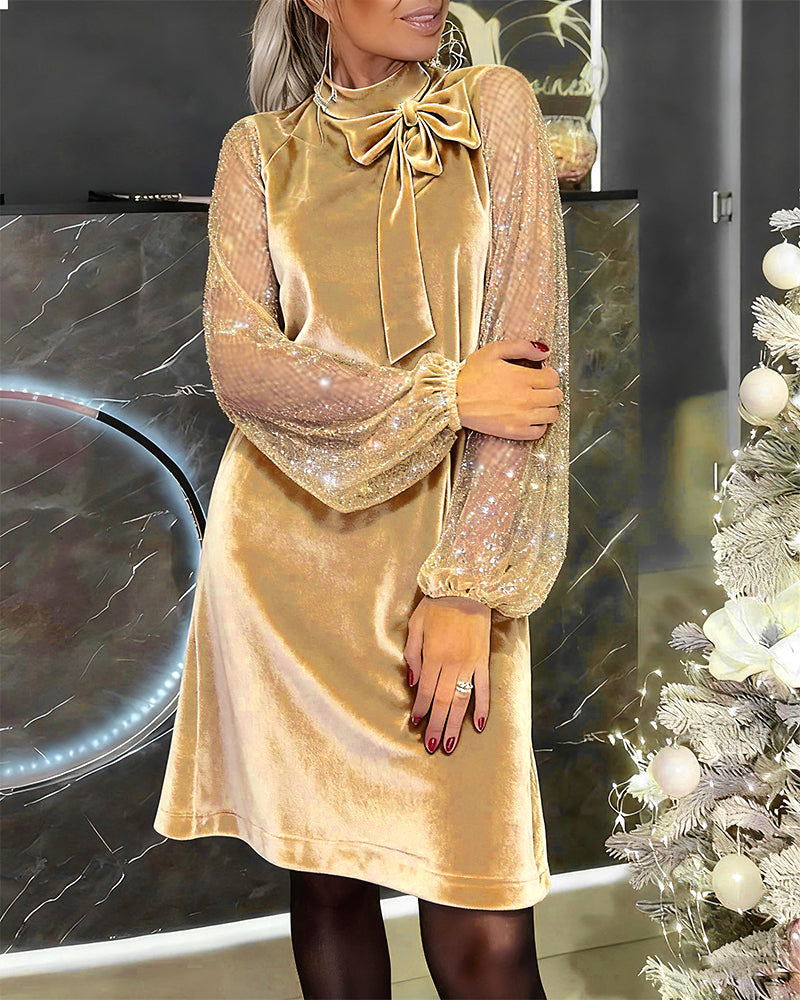 Elegancka sukienka z rękawami typu latarnia i patchworkiem