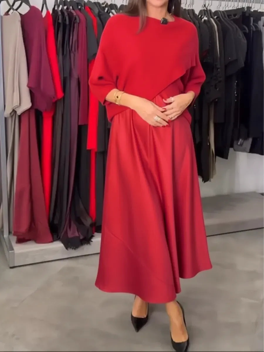 Dwuczęściowy komplet damski składający się z dzianinowego swetra i satynowej sukienki