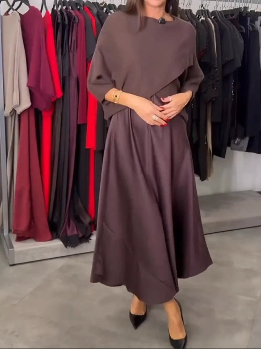 Dwuczęściowy komplet damski składający się z dzianinowego swetra i satynowej sukienki